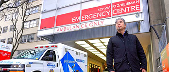 A man standing in front of the emergency entrance