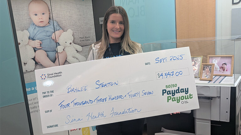 Baylee Stratton, September 17 2025 Payday Payout winner holding cheque.