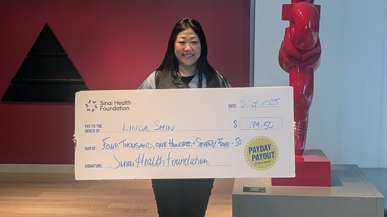 Linda Shin, July 30 2025 Payday Payout winner holding cheque.